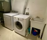 Laundry room with electric dryer